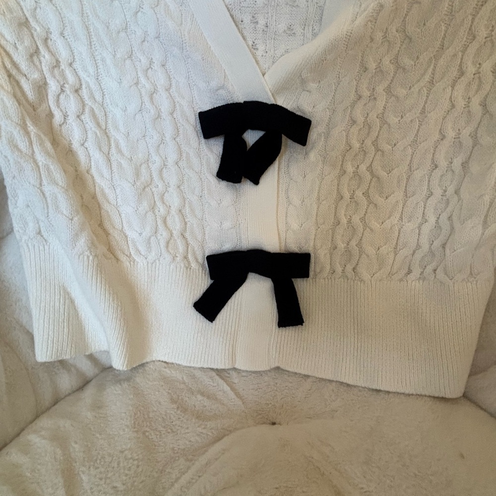 Elegant White Cable Knit Cardigan Sweater with Black Bow Accents